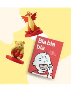 Due personaggi giocattolo, un orso e un drago, accanto a un libro rosso intitolato Bla bla bla
